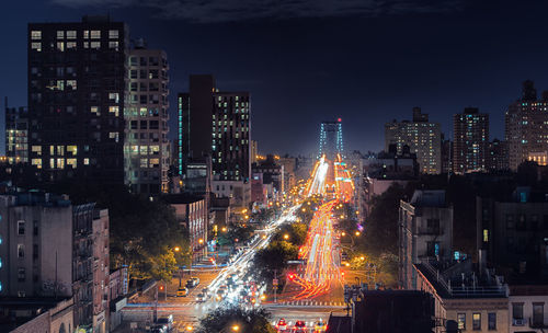 High angle view of illuminated city buildings at night