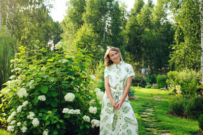 Woman standing in forest