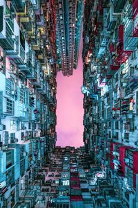Low angle view of buildings in city against sky