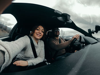 Portrait of woman sitting in car