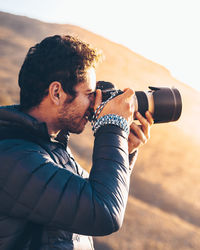 Portrait of man photographing