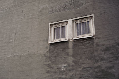 Low angle view of window on wall of building