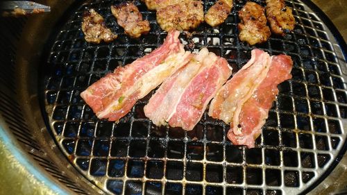 Close-up of meat on barbecue grill