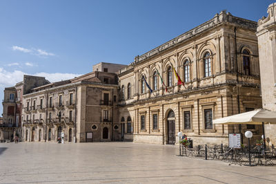 Historic buildings with beautiful facades in piazza duomo in ortigia