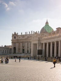 Group of people in front of historical building