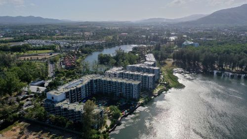 High angle view of buildings and trees against sky