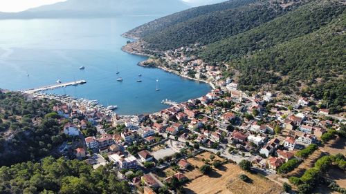 High angle view of townscape by sea