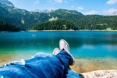 Low section of man relaxing in water