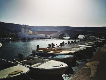 Panoramic view of boats in river against clear sky