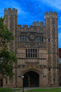 Low angle view of historical building against blue sky