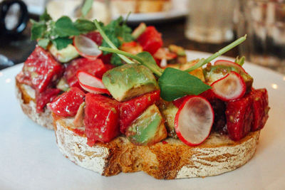 Close-up of open faced sandwich in plate