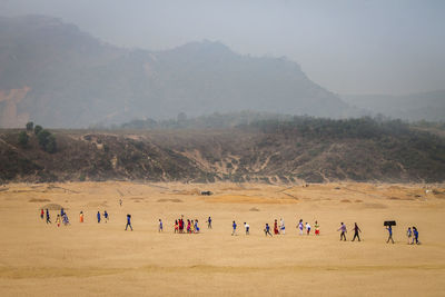 Group of people on arid landscape