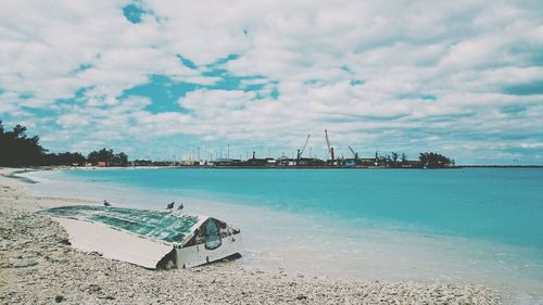 Scenic view of sea against cloudy sky