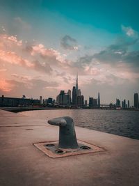 View of buildings against cloudy sky during sunset