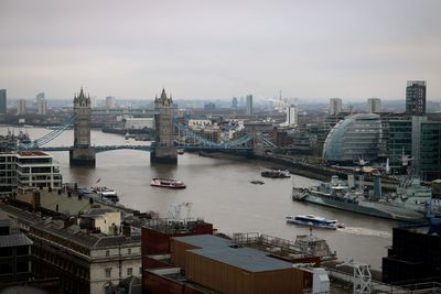 Bridge over river with buildings in background