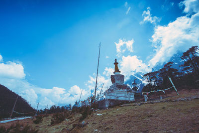 View of temple against cloudy sky