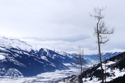 Scenic view of snowcapped mountains against sky