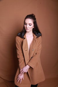 Young woman wearing long coat