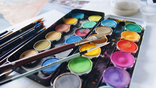High angle view of various containers on table