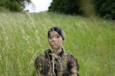 Portrait of teenage girl standing on land