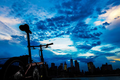 Buildings against cloudy sky