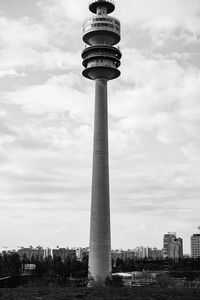 Low angle view of tower against cloudy sky