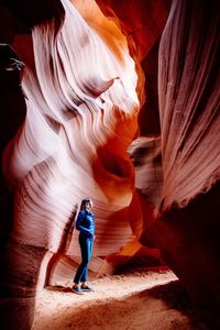 Woman standing in cave