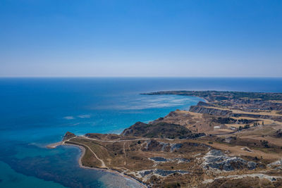 Scenic view of sea against clear blue sky