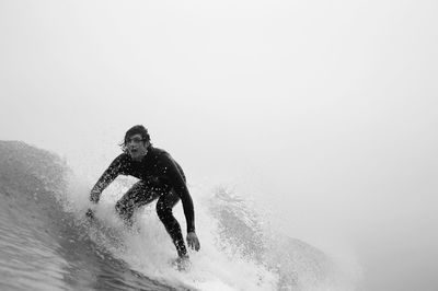 Young man surfing