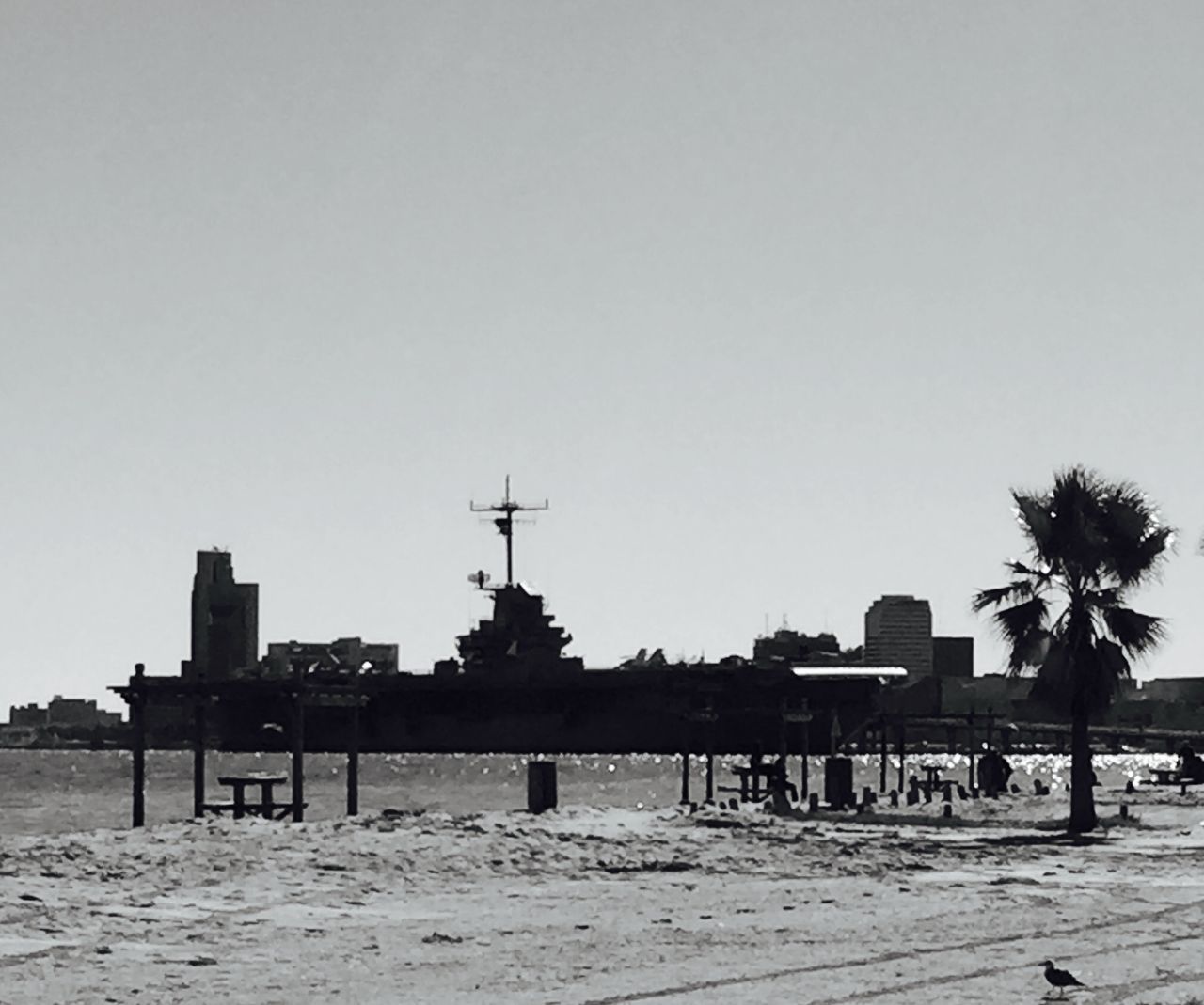 clear sky, copy space, built structure, architecture, water, building exterior, transportation, sea, beach, street light, mode of transport, outdoors, river, sand, incidental people, nature, no people, nautical vessel, harbor, day