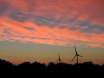 Silhouette landscape against scenic sky