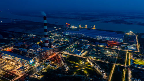 High angle view of illuminated buildings in city at night