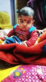 Portrait of cute girl sitting at home