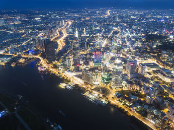 Aerial view of illuminated buildings in city at night