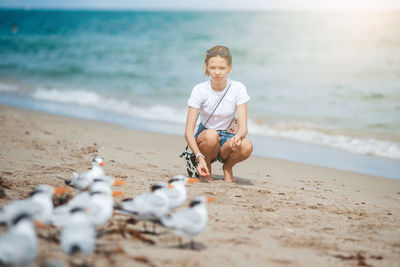 Portrait of woman sitting on beach