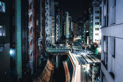 Panoramic shot of illuminated buildings in city at night