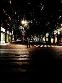 Illuminated street lights at night