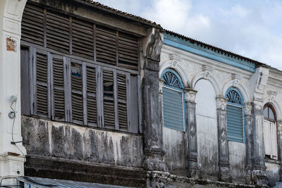 Low angle view of old building against sky