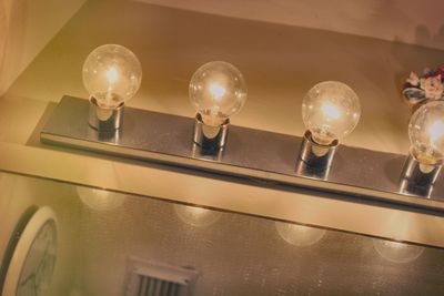 Low angle view of illuminated light bulb