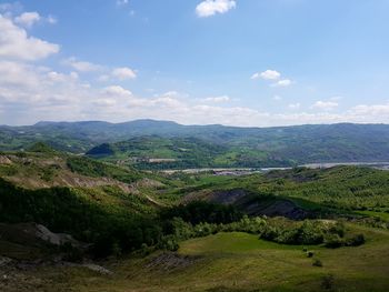 Scenic view of landscape against cloudy sky