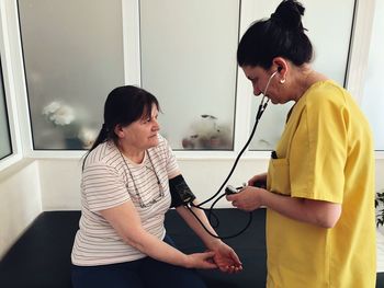 Doctor examining patient at clinic