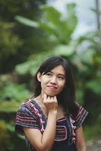 Smiling young woman looking away