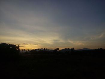 Silhouette landscape against the sky