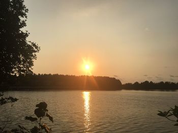 Scenic view of lake against sky during sunset