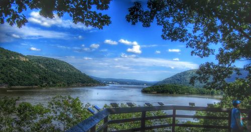 Scenic view of lake against cloudy sky