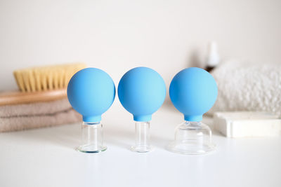 Close-up of colorful balloons against white background