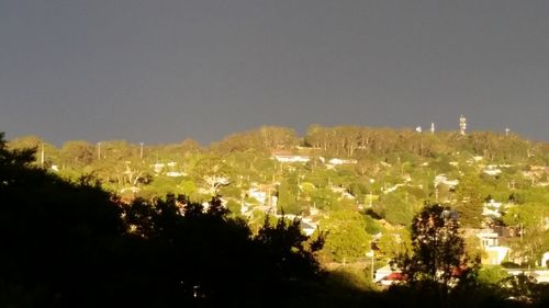 High angle view of illuminated town against clear sky