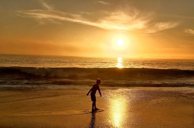 Scenic view of sea at sunset