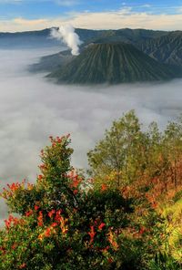 Scenic view of mountains against cloudy sky