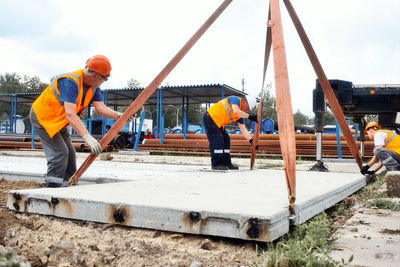 Rear view of man working at playground